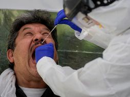 La región más afectada del mundo sigue siendo América, con 7.3 millones. AFP/ARCHIVO