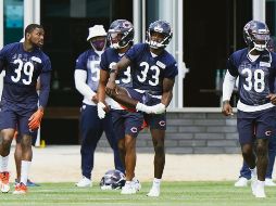 ALERTAS. Nueve jugadores de los Bears de Chicago estuvieron entre los afectados; el equipo cambió su programación de ayer. AP• N. Huh