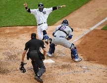 Clint Frazier marca la carrera de la victoria. AFP/S. Stier