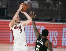 DESTACADO. Goran Dragic (#7) colaboró con 23 puntos para el triufo de Miami. AP