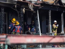 Una mujer de 35 años fue encontrada en la planta baja, mientras que sus tres hijos fueron encontrados arriba. AP/T. Williams-The Philadelphia Inquirer