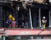Una mujer de 35 años fue encontrada en la planta baja, mientras que sus tres hijos fueron encontrados arriba. AP/T. Williams-The Philadelphia Inquirer