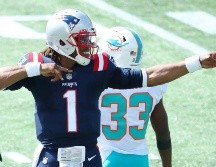 Cam Newton no desentonó como sucesor de Tom Brady al anotar dos touchdowns en acarreos este domingo. AFP / M. Meyer