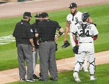 Jimmy Cordero (fondo) le propinó un pelotazo a Willson Contreras, de los Cachorros, el pasado viernes. AP/N. Huh