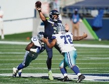 PASO SEGURO. Luego de tres juegos de temporada regular, Russell Wilson acumula 14 pases de TD; ayer vacunó a los Cowboys con cinco envíos anotadores. AP• E. Thompson