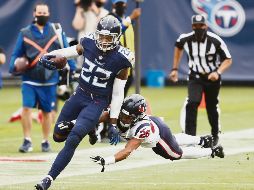 IMPLACABLE. Derrick Henry (#22) tuvo 264 yardas desde la línea de golpeo y sus dos anotaciones de ayer fueron por la vía terrestre. AP• W. Payne