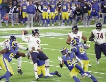 INCISIVOS. La defensiva de los Rams limitó a menos de 300 yardas al ataque de los Bears. AFP• K. Mulcahy