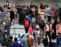 Una fila para registarse en vuelos en Minneapolis, en Minnesota. AP/StarTribune/D. Joles