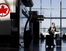 Air Canada enfrenta una brutal caída del flujo de pasajeros calculada en 88% en el tercer trimestre de 2020. AFP/C. Burston