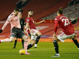 EL DEL TRIUNFO. Oliver Burke (izquierda) consiguió el segundo gol para el Sheffield United. EFE