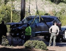 Detallan que Woods conducía a gran velocidad y perdió el control de su vehículo antes de dar varias vueltas de campana al salirse de la carretera. EFE/E. Laurent