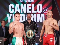 Después de que en ambos casos la aguja de la pesa marcó por debajo de 168, los rivales posaron para la foto. AFP / E. Mulholland