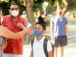 VUELTA A LAS AULAS EN EL ESTADO. Luego del confinamiento por la pandemia del nuevo coronavirus y tras la vacunación de los profesores en la Entidad, los estudiantes volvieron a las escuelas para llevar a cabo actividades de orientación. EL INFORMADOR• F. Atilano