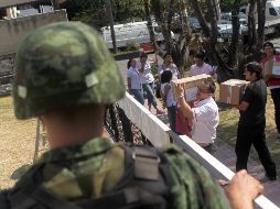 Militares custodian boletas en las elecciones de 2015. Hay municipios de Jalisco donde las condiciones de seguridad no permiten votaciones libres. EL INFORMAODR/Archivo