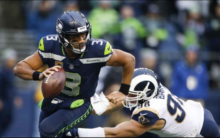 El quarterback de los Seahawks de Seattle Russell Wilson aseguró el jueves que nunca solicitó un canje. AFP / ARCHIVO