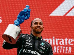 RECONOCE. El piloto británico aplaudió el papel que hizo la escuadra Red Bull para vencerle. AFP. NTUCAT