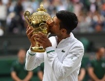Djokovic también se convirtió en el primer hombre desde Rod Laver en 1969 que conquista los tres primeros grandes en una temporada. EFE / N. Hall