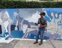 Roberto Márquez realiza una pintura con la técnica del acrílico, confirmado por tres piezas, incluye caballos, instrumentos musicales y varios músicos de mariachi, con un estilo cubista y unas dimensiones de 1.70 x 2.20 metros. EL INFORMADOR / J. Pérez