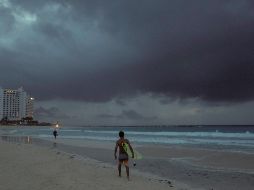 El organismo prevé que el huracán se fortalezca aún más antes de que su centro alcance el este de México. AP / ARCHIVO