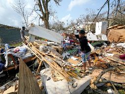 Millones de personas continuaban hoy bajo advertencia de posibles inundaciones a medida que el agua acumulada seguía fluyendo hacia los ríos. AP / ARCHIVO