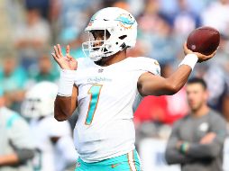 ENCENDIDO. Tagovailoa completó 16 de 27 envíos para 202 yardas con un touchdown y una intercepción, también anotó en carrera de tres yardas para guiar a una reforzada defensiva sobre la reconstruida defensiva de los Patriots. AFP/A. GLANZMAN