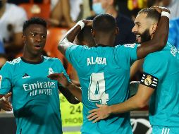LÍDERES. El triunfo deja solo en cabeza de la tabla al Real Madrid, con trece puntos. AFP/J. JORDAN