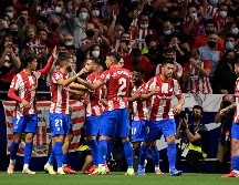 Con este triunfo, el equipo 'Colchonero' empata a puntos con el líder Real Madrid, que el domingo juega en campo del Espanyol. AFP/J. SORIANO
