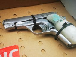 Al realizarle una inspección, policías le encontraron al hombre una pistola aparentemente del calibre .22. ESPECIAL /