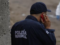 Oficiales de la Comisaría de Tlajomulco localizaron en un lote baldío a un hombre muerto. EL INFORMADOR/ARCHIVO