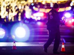 Un oficial de policía resguarda la zona del tiroteo en Lakewood, Colorado. AFP / Getty Images / M. Ciaglo