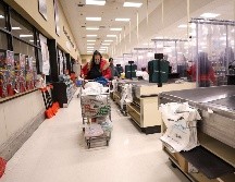 La fácil transmisibilidad de la variante ómicron está afectando a empresas, oficinas gubernamentales y servicios públicos por igual. AFP/M. Loccisano