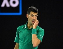 EN VILO. La audiencia de Djokovic determinará si podrá o no participar en el Abierto de Australia, en donde tiene una cita con la historia. AFP/P. Crock