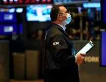 Wall Street moderó sus pérdidas al final de la sesión tras el anuncio de sanciones estadounidenses contra Rusia. AFP/T. Clary