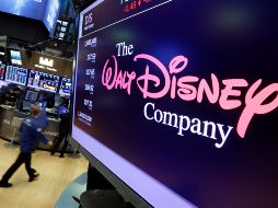 FILE - In this Aug. 8, 2017, file photo, The Walt Disney Co. logo appears on a screen above the floor of the New York Stock Exchange. On Thursday, April 11, Disney is unveiling details of its long-awaited streaming service Disney Plus. (AP Photo/Richard Drew, File) Disney Streaming Service-AUG. 7, 2017, PHOTO FILE PHOTO