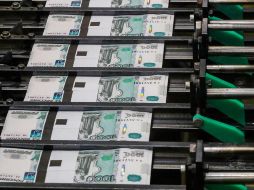 La economía rusa se ha visto fuertemente golpeada por las sanciones impuestas por la invasión de Ucrania, el rublo tuvo este lunes su mínimo histórico frente al dólar. EFE/ S. ILNITSKY