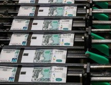 La economía rusa se ha visto fuertemente golpeada por las sanciones impuestas por la invasión de Ucrania, el rublo tuvo este lunes su mínimo histórico frente al dólar. EFE/ S. ILNITSKY