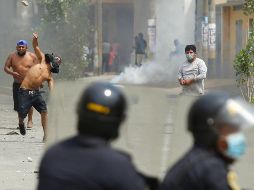 Las protestas han dejado tres muertos y una veintena de detenidos. AFP/G. Masko