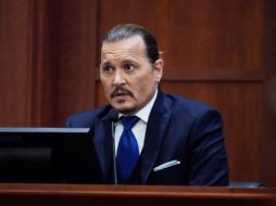 Depp hizo una gesto de vergüenza mientras se reproducían las grabaciones. AP / S. Helber