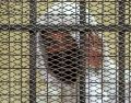 Mohamed al Amin en una jaula de acusado durante su juicio por "trata de personas" y "agresión sexual" en El Cairo. AFP/ K. Kamel