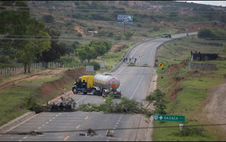 Denuncian que ese el 19 de junio, 20 personas que no participaron en las manifestaciones y toma de carreteras fueron aprehendidas sin una orden de detención. AP/ARCHIVO