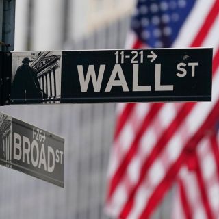 Wall Street sube tras aumento de tasas de interés de la Fed