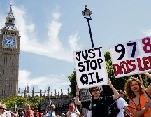 Manifestantes llaman al Gobierno a tomar medidas ambientales urgentes. AFP/N. Hallen