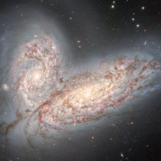 Logran captar imagen de dos galaxias espirales en proceso de colisión y fusión