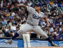 Julio Urías va por su segundo trofeo de campeón. Esta temporada lleva 17 victorias por 7 derrotas promediando 2.12 carreras limpias en 30 juegos. AP / ARCHIVO