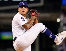 Julio Urías terminará la temporada con la mejor efectividad de la Liga Nacional, 2.16, y foja de 17-7. AP / M. J. Terrill