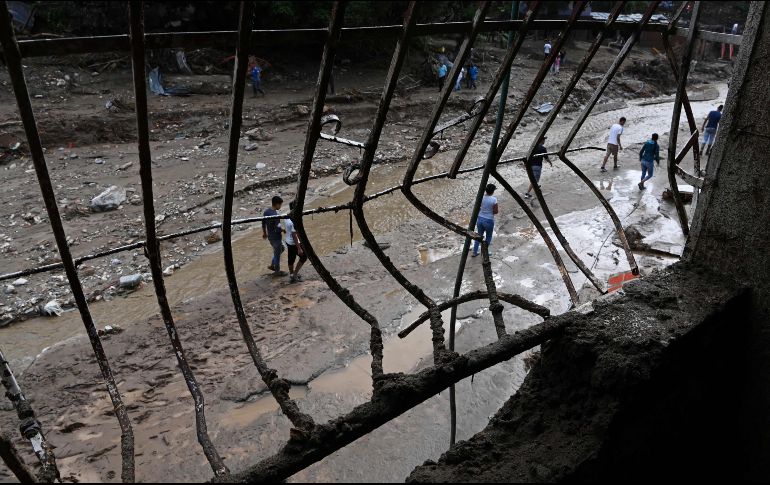 La onda tropical 41 de la temporada provocó tasas máximas de precipitaciones, inundaciones y daños materiales en 11 de los 23 estados venezolanos. AFP/Y. Cortez
