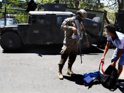 Desde marzo de este año, El Salvador combate a las pandillas con un régimen de excepción que tiene al Ejército en las calles del país. AFP