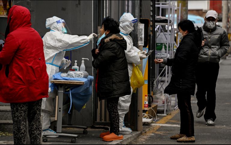 Al estallar la pandemia de COVID-19, China adoptó medidas que eran muy estrictas, pero que no se alejaban de lo que muchos otros países estaban haciendo para tratar de contener el virus. AFP / N. Celis