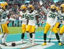 Los Green Bay Packers mantuvieron sus posibilidades de clasificarse para los playoffs de la NFL. AFP/Eric Espada