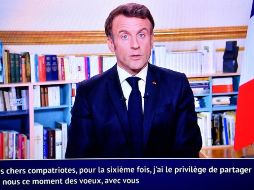 El presidente francés, Emmanuel Macron, habla durante su tradicional mensaje de fin de año. AFP/J. De Rosa